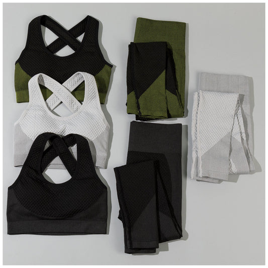 Collection of athletic wear including sports bras and leggings on a light gray background